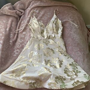 White and gold frilly dress